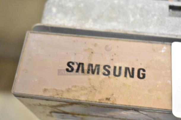 Samsung DW80M2020US stainless steel undercounter dishwasher, showing visible Samsung logo on control panel.