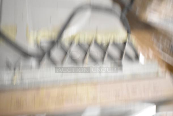 Blurry image of a Samsung DW80M2020US stainless steel undercounter dishwasher, 120 volts, 1 phase.