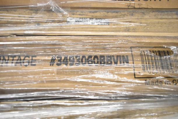 Packaged items labeled #3493060BBVIN, Lancaster Table & Seating, wrapped in plastic, indicating scratch and dent condition.