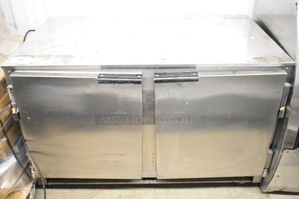Beverage Air UCR48A stainless steel 2-door undercounter cooler, used, 115V, 1 phase. Scratches and wear visible.