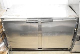 Beverage Air UCR48A stainless steel 2-door undercounter cooler, used, 115V, 1 phase. Scratches and wear visible.