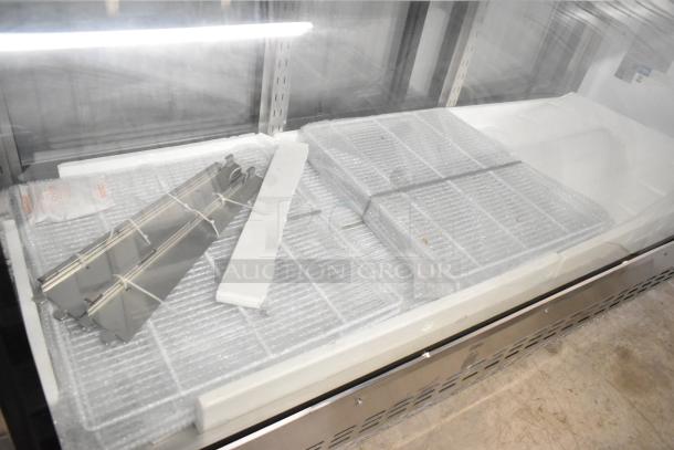 2024 Avantco 178DLC82HCS deli display case, stainless steel, 115V, 1 phase, interior with shelves and packaging materials visible.