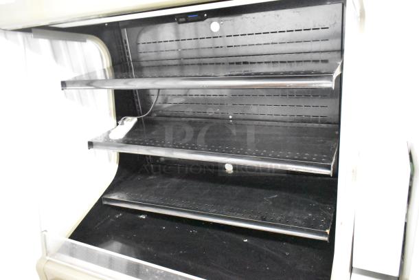Hussmann GSVM-4060 metal merchandiser, 115V, 1 phase, three-tier shelves, used condition, ideal for commercial display.
