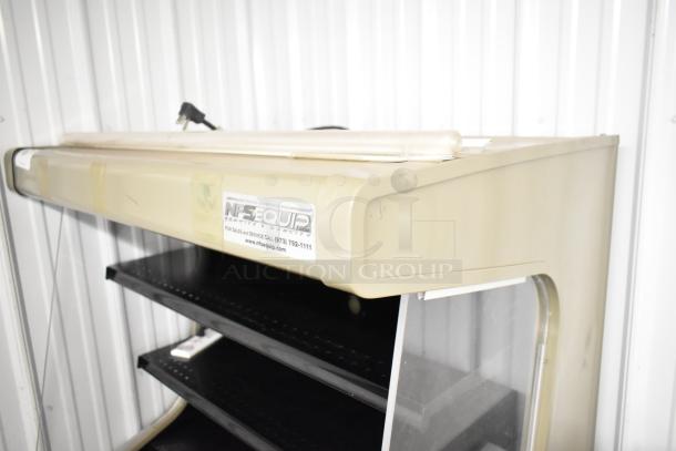 Hussmann GSVM-4060 commercial grab-n-go merchandiser, metal, 115 volts, 1 phase, beige, black shelves; sticker visible.