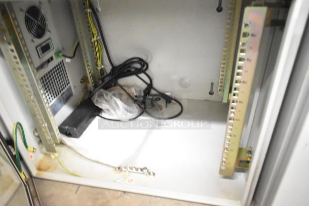 BlackShields DC0300 white metal cabinet interior with cables and wiring. Good condition, features power units and rack mounts.