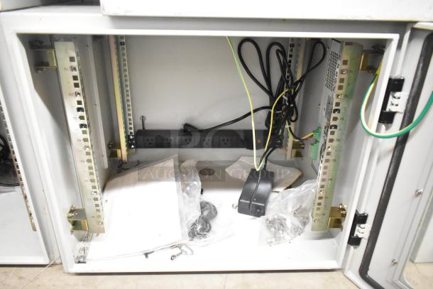 2 BlackShields DC0300 white metal cabinets, open view showing interior wiring and hardware, in good condition.