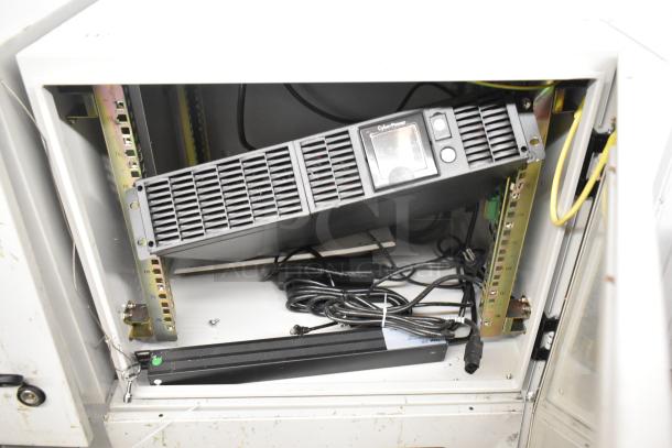 2 BlackShields DC0300 white metal cabinets, showing interior shelving and wiring, clean condition, ideal for secure storage.