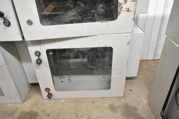 BlackShields DC0300 white metal cabinet with glass doors, visible wear, and locks. Two units available per bid.