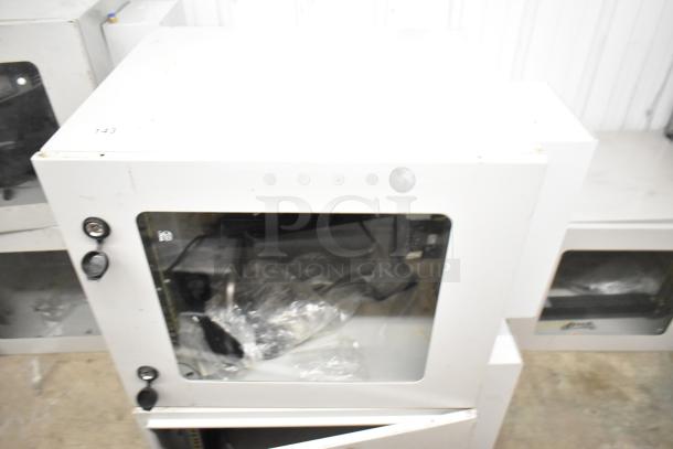 2 BlackShields DC0300 white metal cabinets, slightly used. Front glass panel, dual locks, model DC0300 visible.