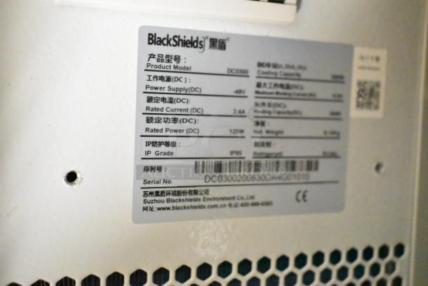BlackShields DC0300 white metal cabinet label, showing model details, power supply 48V, IP grade 65, serial number.