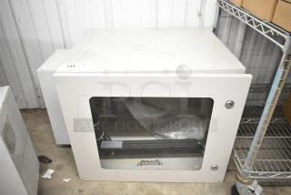 BlackShields DC0300 white metal cabinet, used condition, glass front with visible cabling, model tag on bottom.