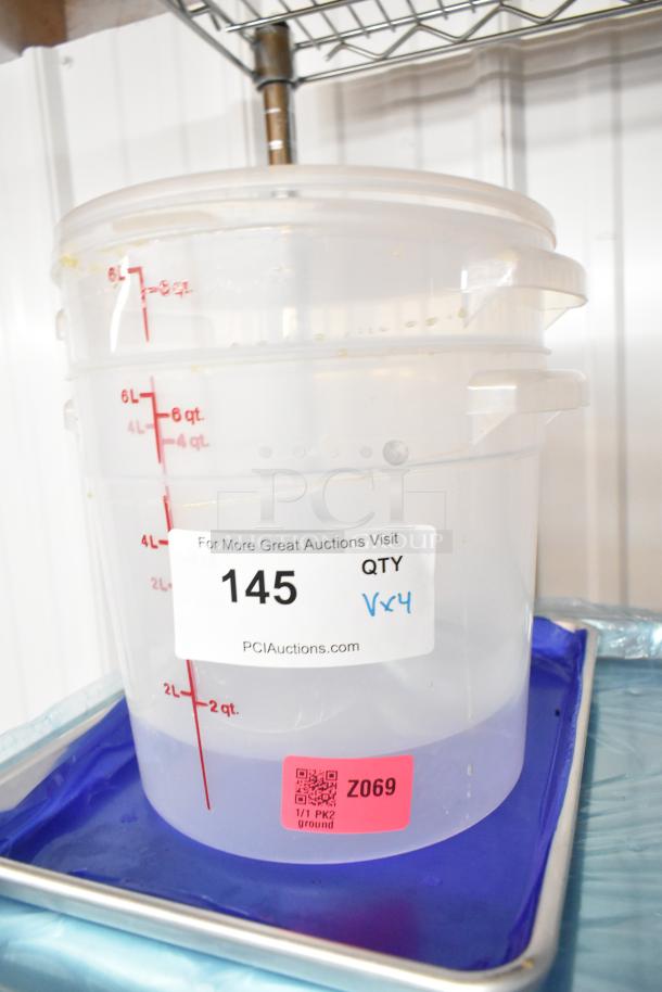 Brand new scratch and dent poly container with measurement markings, auction label 145, part of a lot including pans.