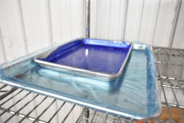 Brand new BlackShields 407BUNQRTR aluminum bun pans, poly containers. Choice sizes, slight dents, model DC0300.