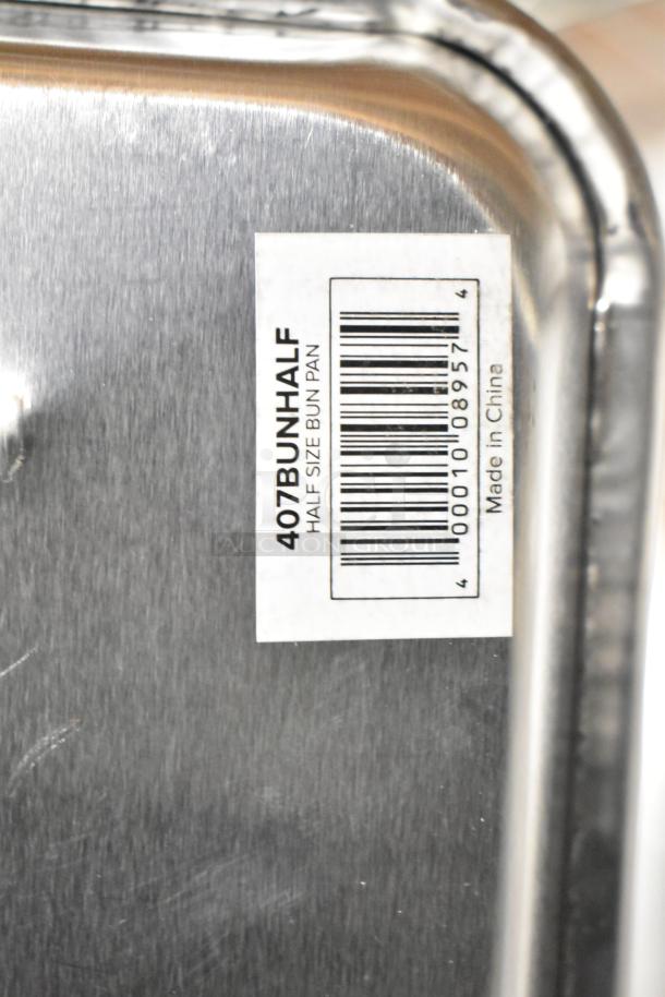 Half-size bun pan with barcode label reading "407BUNHALF Half Size Bun Pan, Made in China". New condition.