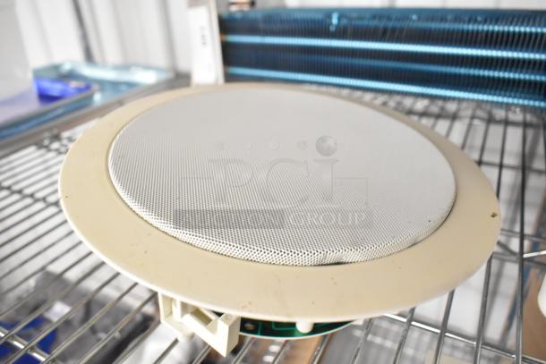 Broan AE80B-B Flex Series ventilation fan, 80 CFM, 0.7 sones, with a round white speaker. Slight wear visible.