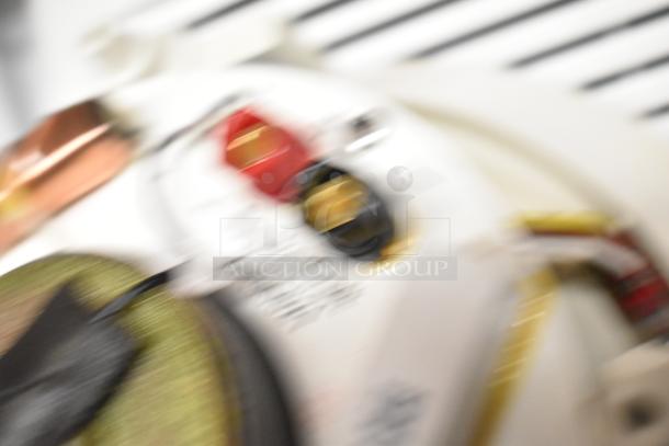 Blurry image of electronic components and wiring, possibly related to audio equipment or ventilation systems.