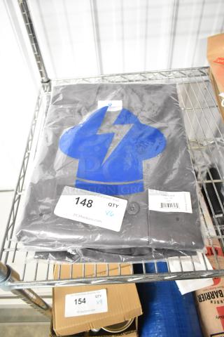 Slate gray chef shirt by Uncommon Chef, new condition, sealed in packaging. Size small, scratch and dent. Quantity: 6.