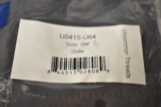 6 Uncommon Chef slate gray chef shirts, brand new with minor imperfections. Label reads "U0415-U64", size SM.
