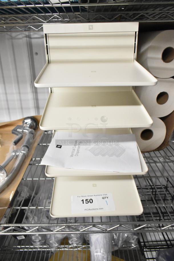 White four-tier countertop filing system, excellent condition, includes assembly manual and auction tag number 150.