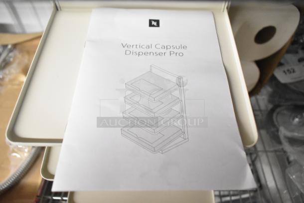 White countertop 4-tier filing system, pristine condition, compact design with smooth edges. Ideal for organizing documents.