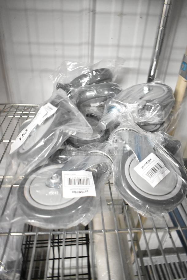 Lot of 8 new Lavex Pro 2575MPBX 5" gray polyurethane shelving stem casters with brake. Scratch and dent condition.