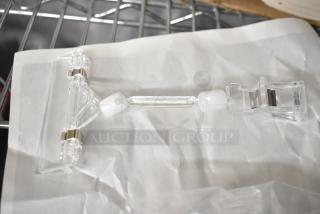 Clear plastic poly unit with metal hinges, shown on a white background. Auction includes a set of six units.