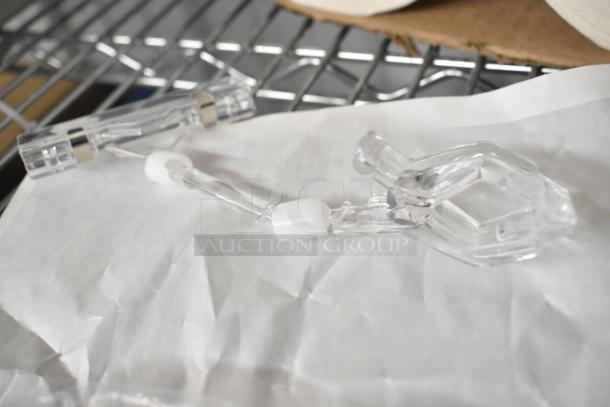 Clear poly units, set of 6, in excellent condition, displayed on a paper-covered surface.