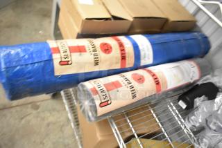 Two rolls of Sealtech Weed Barrier in blue packaging on a metal shelf. Labels indicate brand and usage.