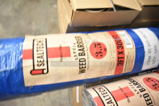 Two rolls of Sealtech Weed Barrier, 3ft x 300ft each, heavy duty. Visible labels indicate durability and coverage size.