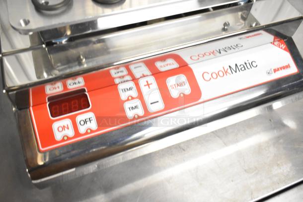 Brand new Pavoni CookMatic Tartlet Machine, stainless steel, digital controls, 110V, 1 phase, slight scratches.