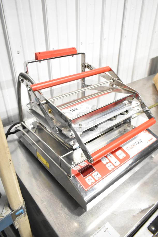 BRAND NEW Pavoni CookMatic stainless steel tartlet machine, with digital controls, labeled 160, 110V, 1 Phase.