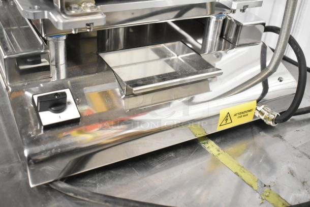 Brand new Pavoni CookMatic tartlet machine, stainless steel, 110V, 1 Phase, with control dial and warning labels visible.