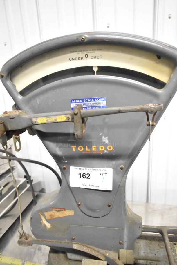 Toledo 3420 countertop metal bakery scale, vintage, gray body, visible wear, Toledo logo, Algen Scale Corp sticker.