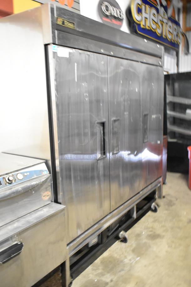 True T-72F stainless steel commercial 3-door reach-in freezer with poly-coated racks, on commercial casters, 115 volts, 1 phase.