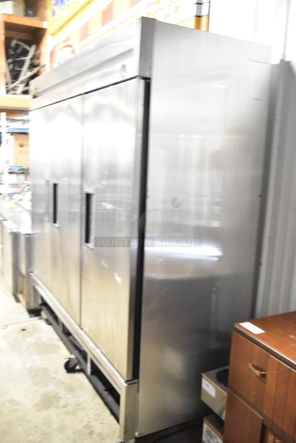 True T-72F stainless steel commercial 3-door reach-in freezer, poly-coated racks, on casters, 115V, 1 phase.