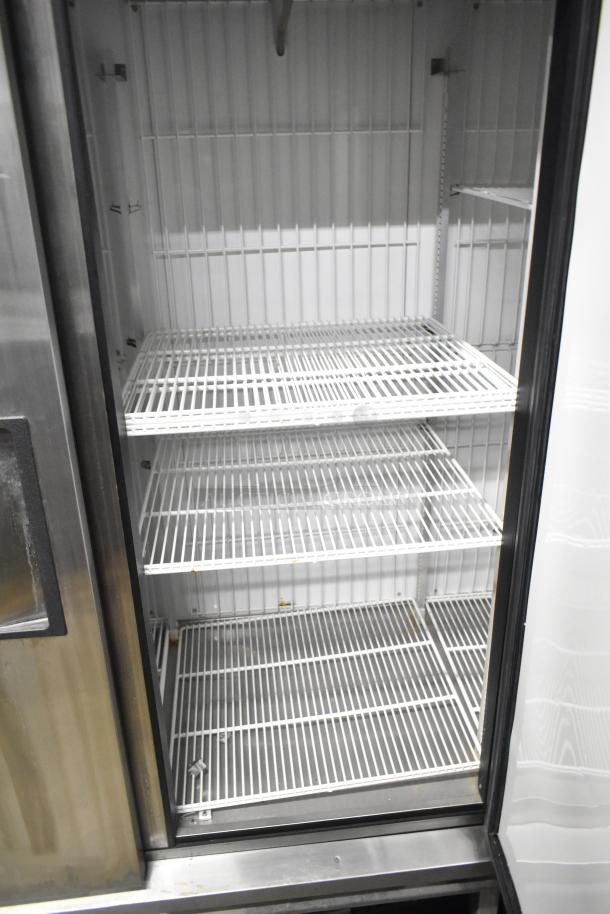True T-72F stainless steel 3-door commercial freezer with poly-coated racks and commercial casters. 115 volts, 1 phase.