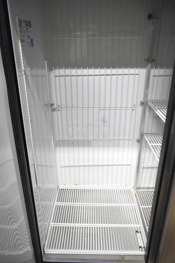 True T-72F stainless steel commercial freezer, 3 doors, includes poly-coated racks, on commercial casters. 115 volts, 1 phase.
