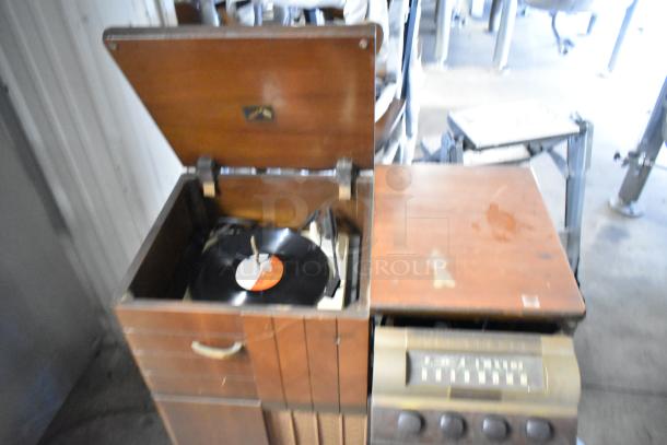 Victrola RCA Victor 67V1 wood pattern counter with record player, features vintage design and classic controls; visible wear.