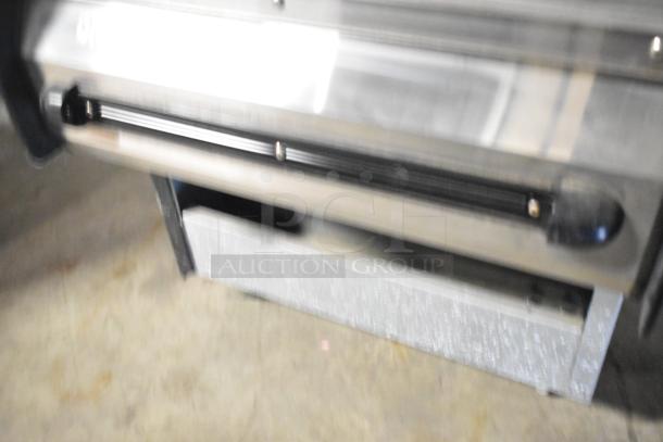 BKI HSS2-4T metal hot merchandiser with multiple shelves, on casters, 208V, 1 phase, commercial-grade condition.