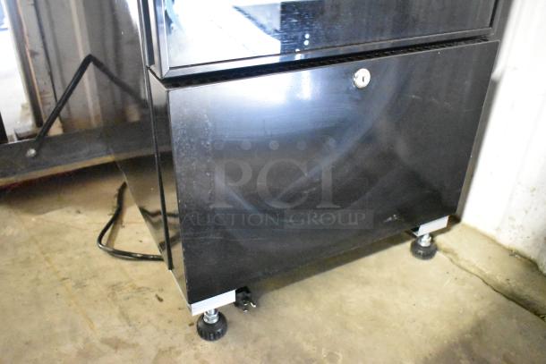 BRAND NEW KoolMore KM-MDF-17S reach-in freezer, black metal with poly-coated racks, single door, 115 volts, minor scratches.