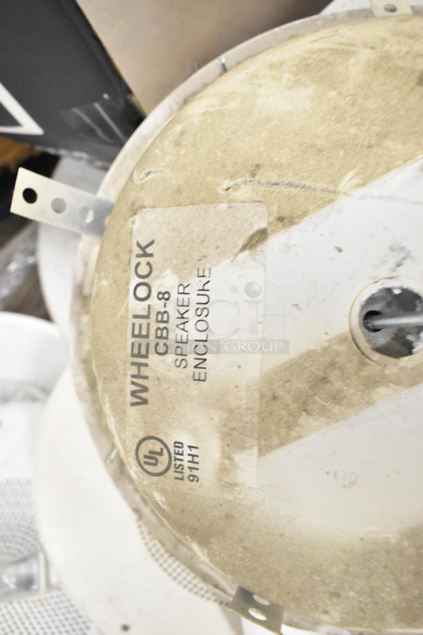 Wheelock CBB-8 speaker enclosure with UL listing. Dusty condition. Label indicates model and certification details.