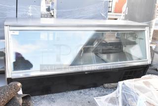 Leader metal deli display case merchandiser, commercial floor style, glass front. Good condition with minor wear.