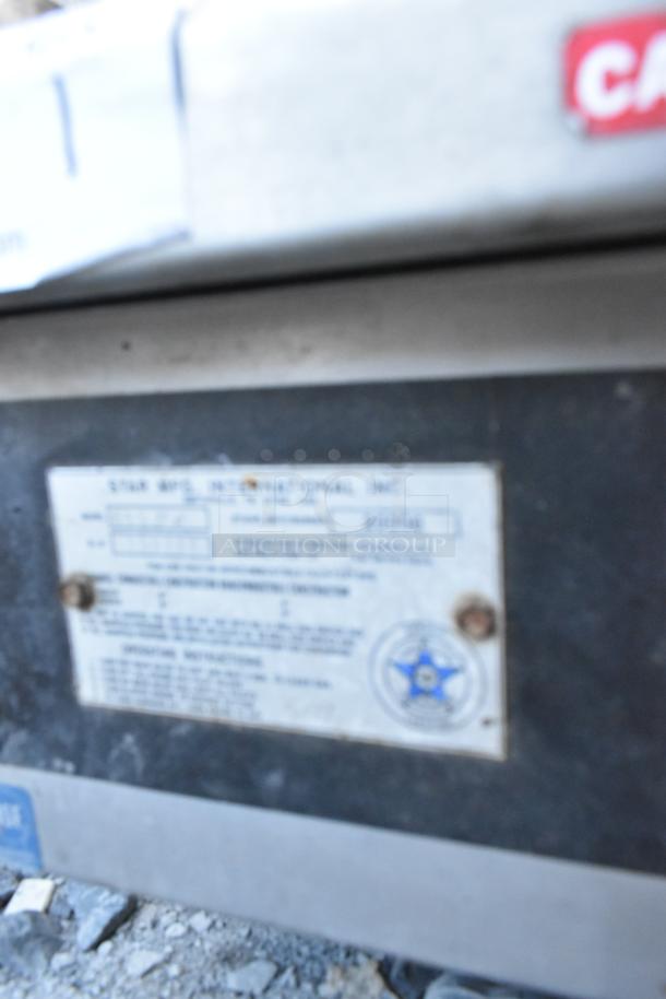 Star stainless steel commercial countertop gas griddle, shows manufacturer's label with model details.