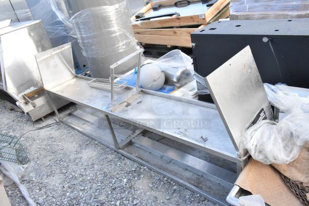 Stainless Steel 2 Tier Over Shelf in used condition. Features dual levels, sturdy construction, and visible wear. Ideal for kitchens.