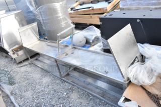 Stainless Steel 2 Tier Over Shelf in used condition. Features dual levels, sturdy construction, and visible wear. Ideal for kitchens.