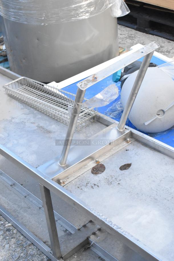 Stainless Steel 2 Tier Over Shelf with sturdy design, adjustable height. Signs of wear present, suitable for commercial use.