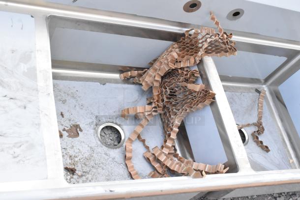 Brand new Regency 600S32323224 stainless steel 3-bay sink with dual drain boards, no legs, scratch and dent.