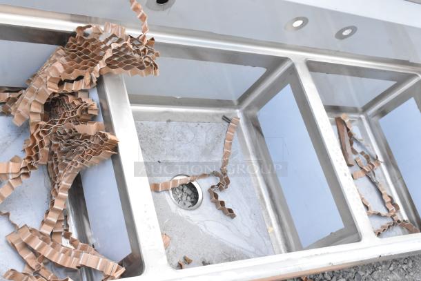 Brand new Regency 600S32323224 stainless steel 3-bay sink with dual drain boards. Scratch and dent, no legs included.