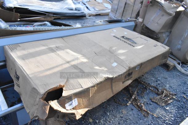 Damaged box containing Suncast BMCCPD7204 dark gray 5-shelf heavy-duty tall storage cabinet, brand new, some dents visible.