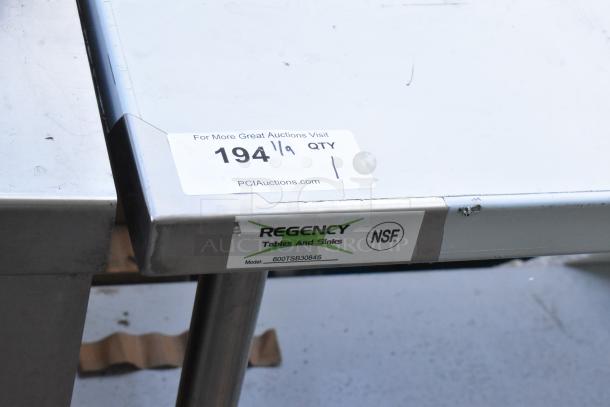 Regency 600TSB3084S stainless steel commercial table with metal under shelf, NSF certified, visible model label.